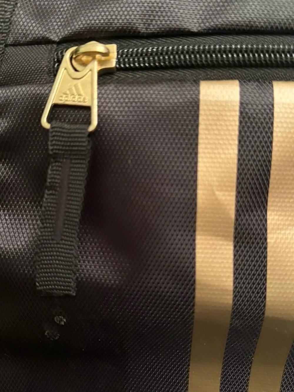 adidas Black Backpack with Gold Stripe Accents